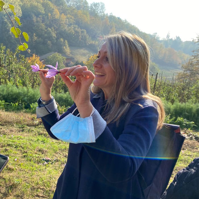 Alice with purple flowers on Tuscany tour